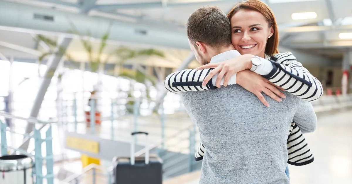 Long distance couple at the airport