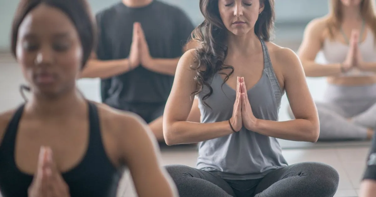 group of people practicing yoga